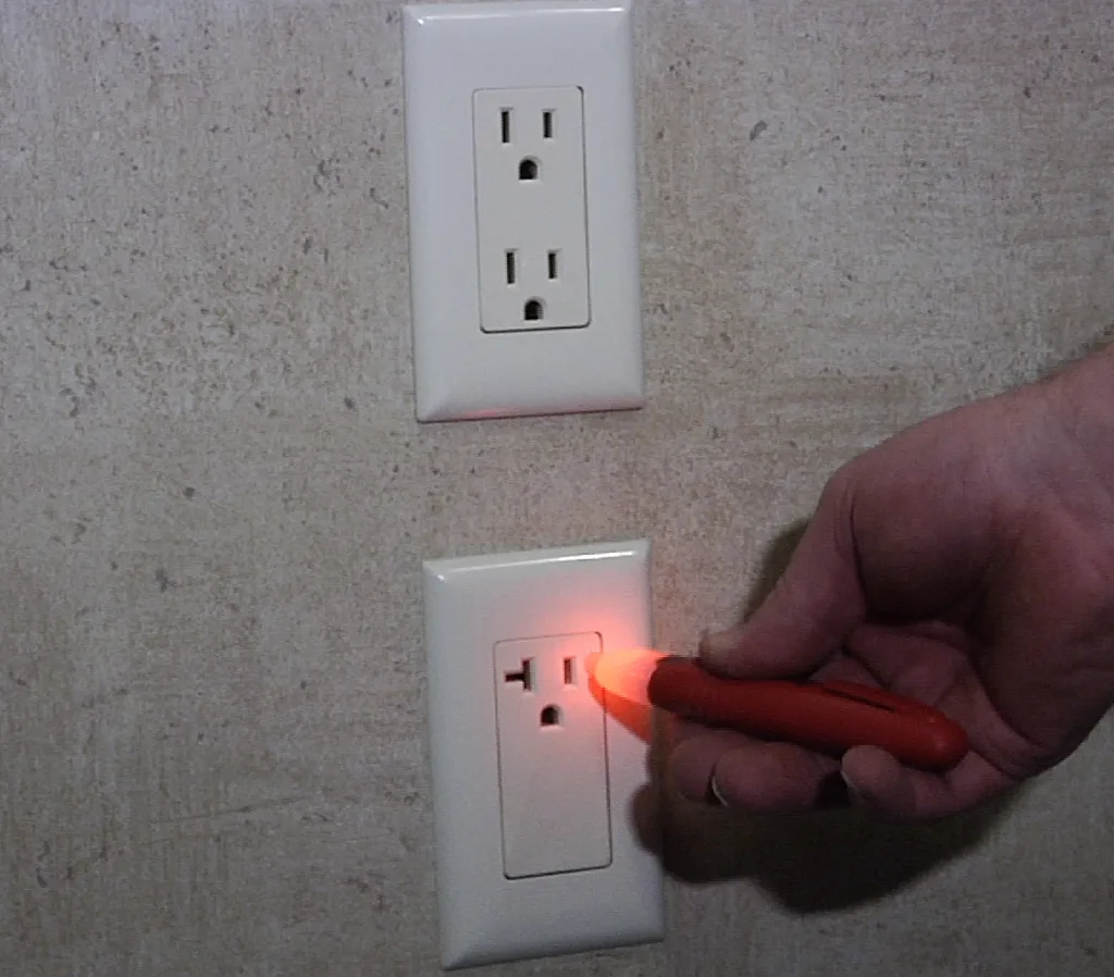 RV shore power connection and electrical panel being inspected